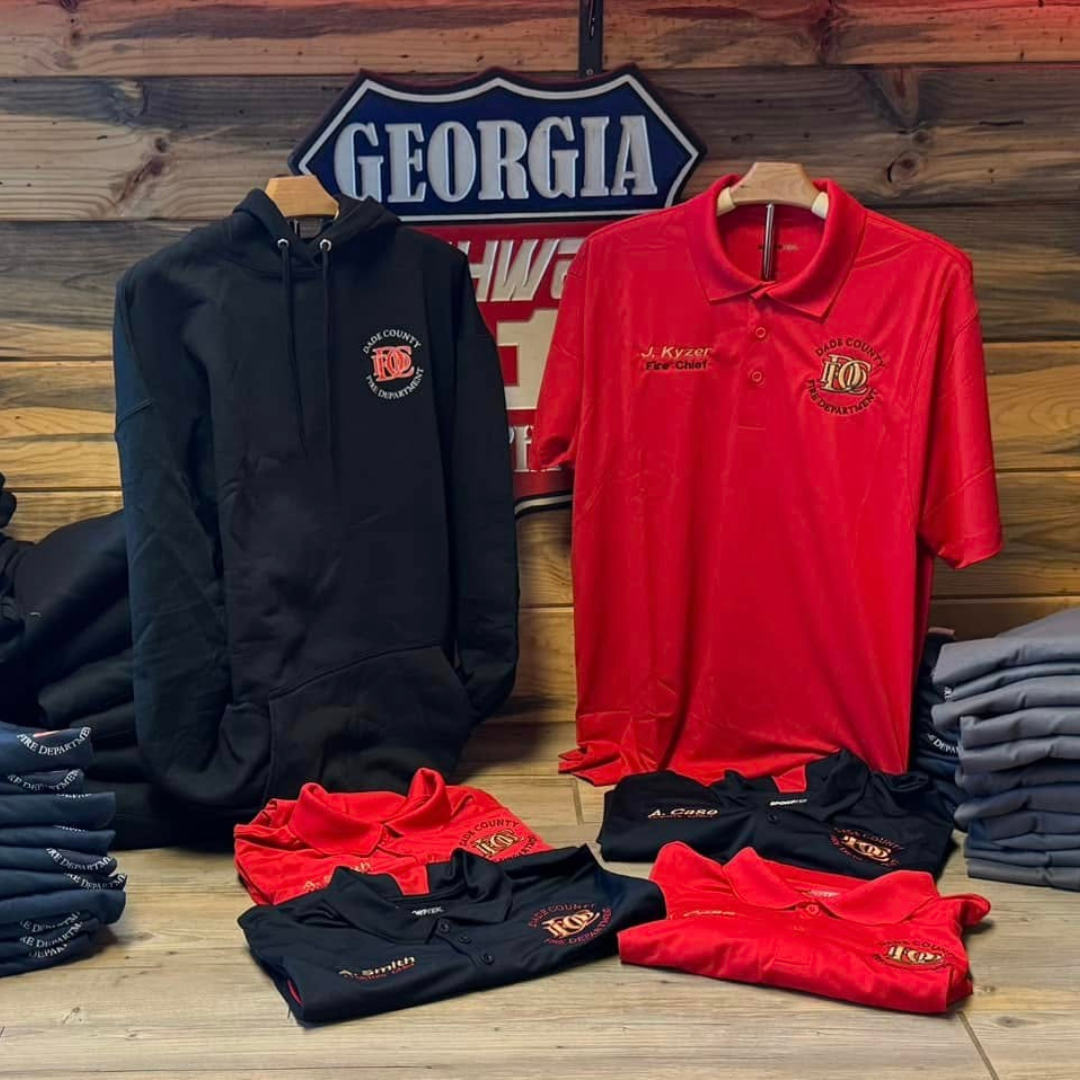 branded apparel for fire department with highway 11 graphics sign in the background