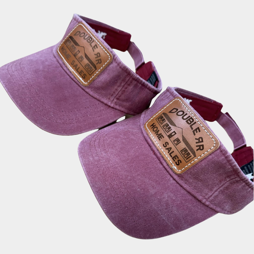 two purple visors with leather patch logos that say "Double RR Home Sales"