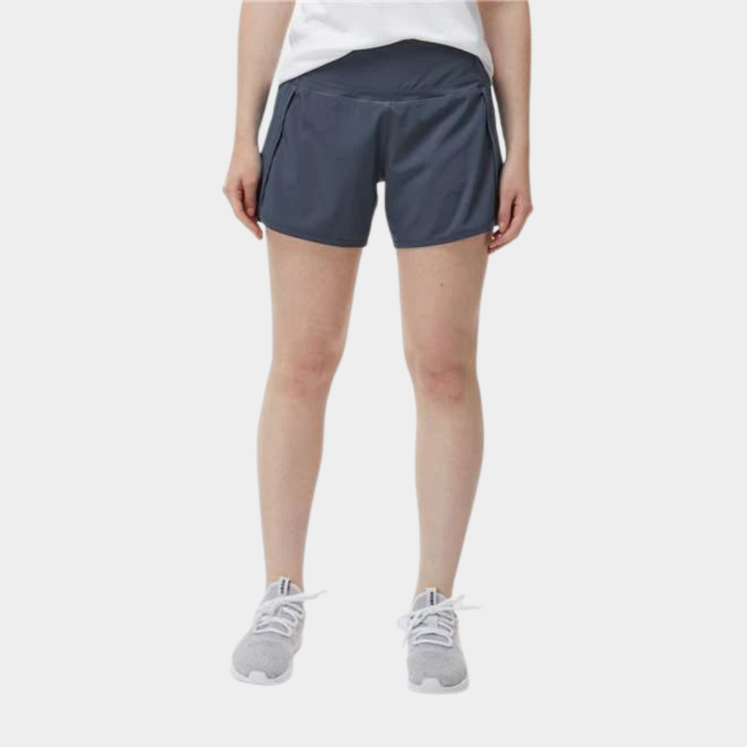 bottom half view of person wearing blue/gray shorts and a white shirt