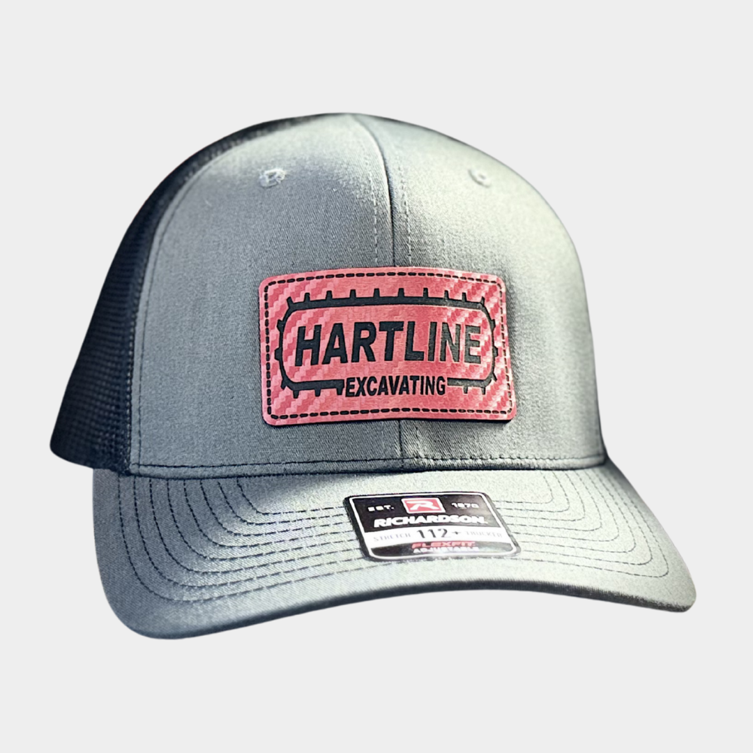 picture of grey and black hat with red logo for Hartline Excavating