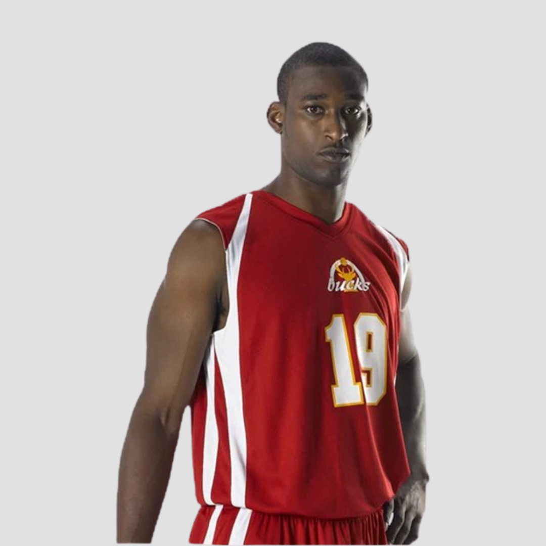 sideview of a man in a red basketball uniform