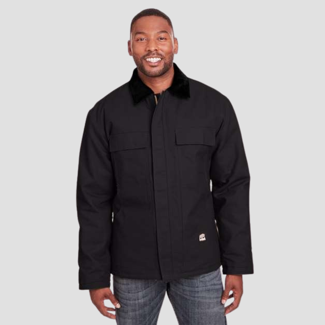 man smiling for camera wearing black work jacket